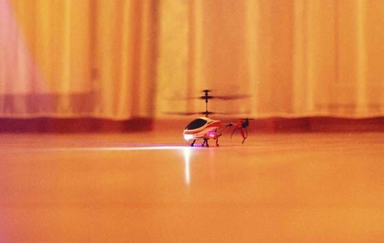 Toy radio-control helicopter at the floor